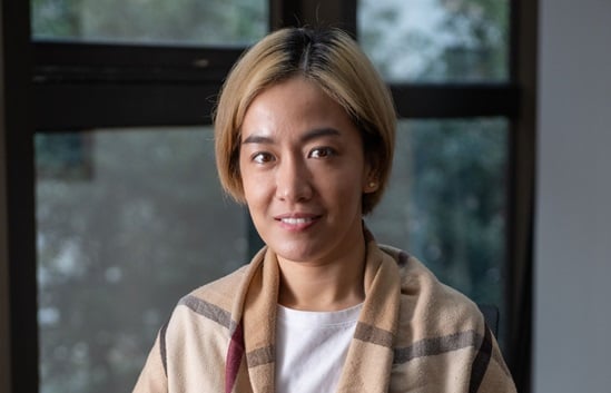 Tuberculosis survivor, Mildred Fernando Pancho, in her office in the Philippines
